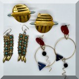 J147. 3 Sets of goldtone and mixed material earrings. Earrings with blue stones are missing one stone. - $36 